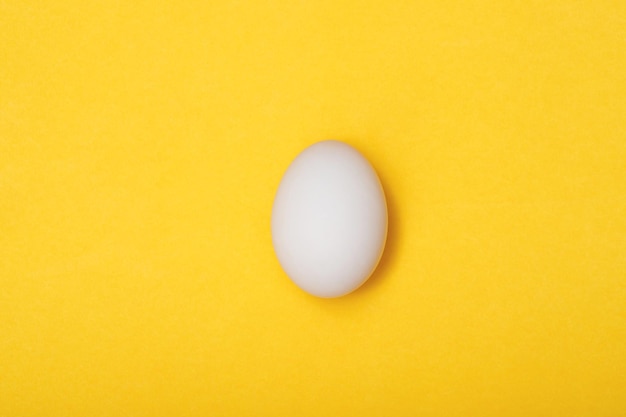 Top view egg yolk and egg white high protein good for body yellow background