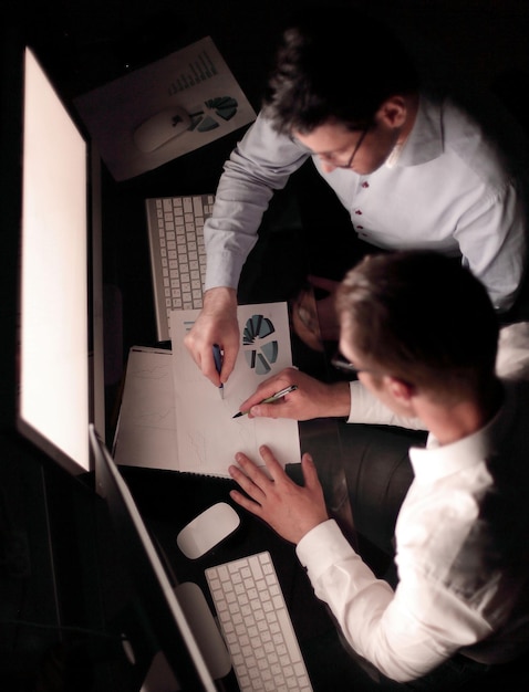 Top view employees checking financial data