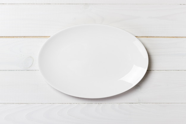 Top view of empty white food plate