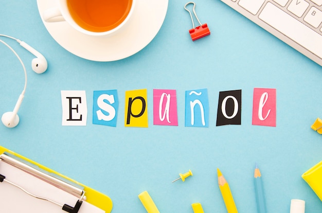 top view espanol lettering on blue background