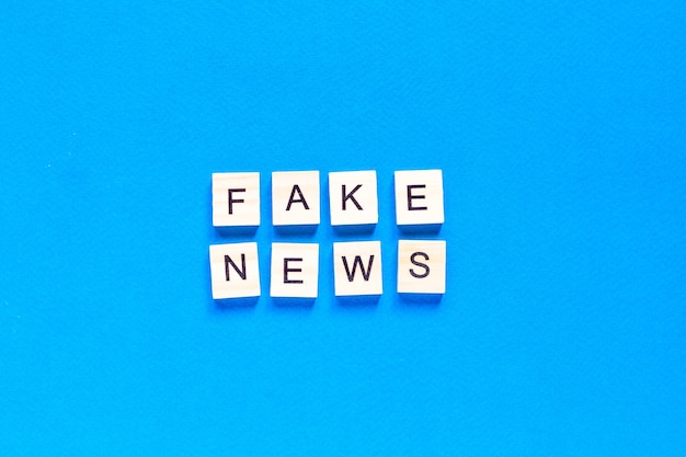 Top view fake news concept with wooden letters