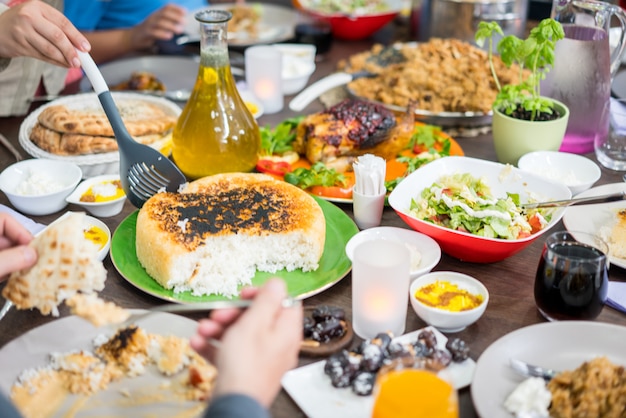 Top view of family and friends eating food on table