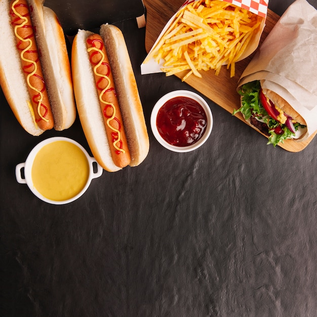 Top view fast food composition with space on bottom