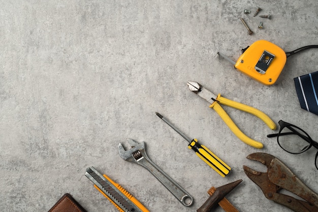 Top view of Fathers day and labor day concept with working tools on blue background.