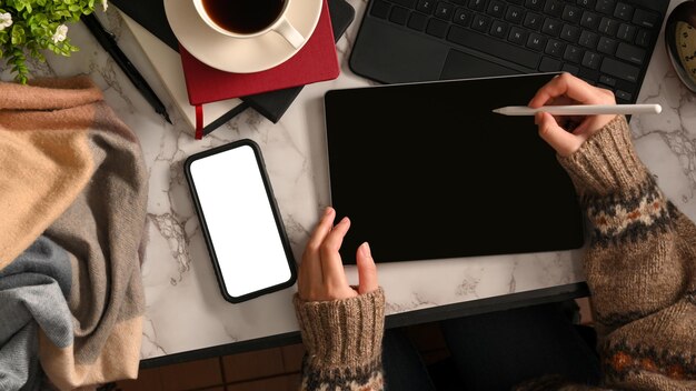 Photo top view of female designer hands working with digital tablet on modern workspace