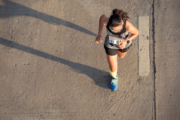 Top view of fitness female running morning with copy space