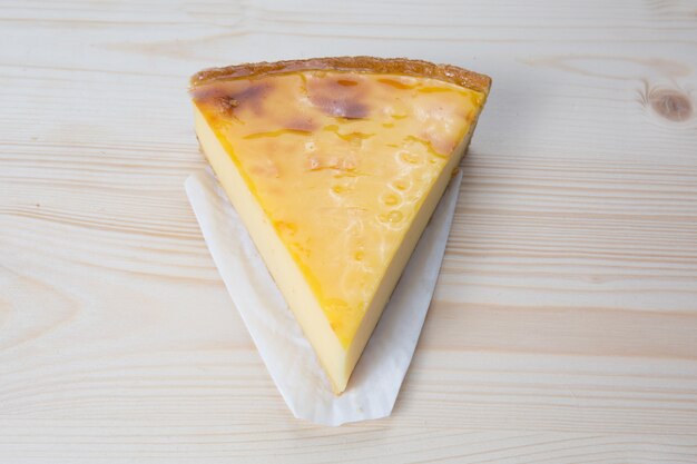 Top view of a Flan at home, under a wooden table