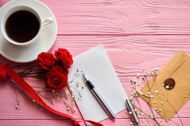 Top view flat lay blank paper with coffee and flowers