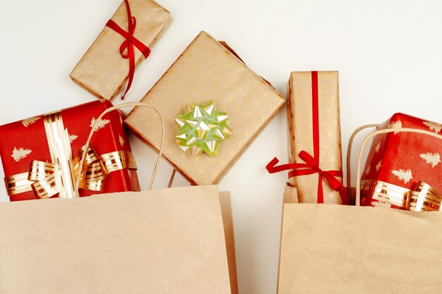 Top view, flat lay of red Christmas gifts on white 