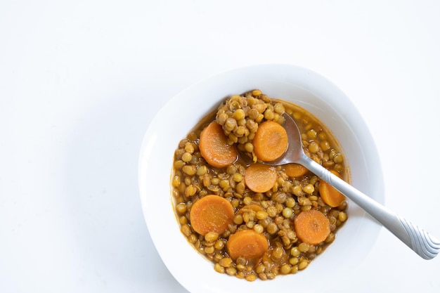 Top view of flexitarian legume dish on white background with copy space