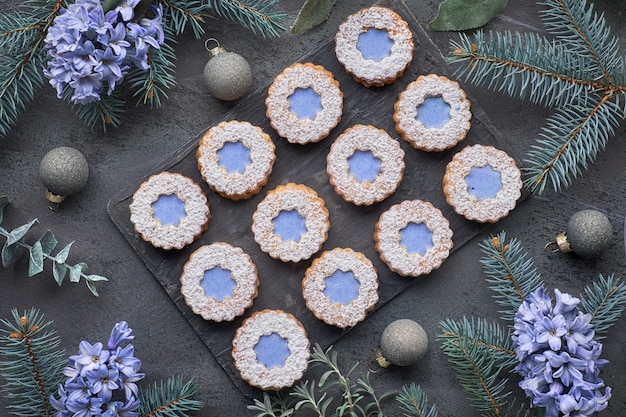 Top view of flower Linzer cookies with blue glazing