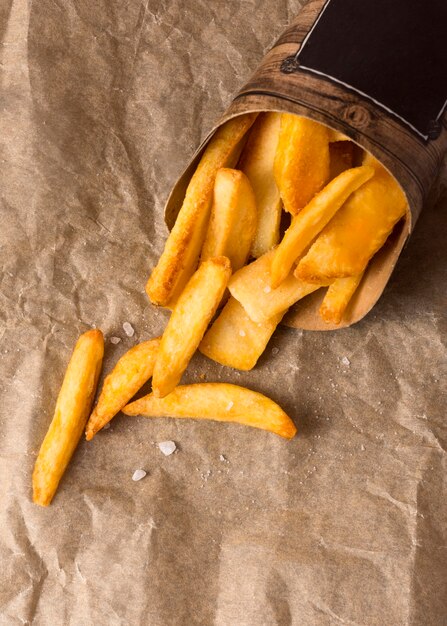 Top view of french fries on paper