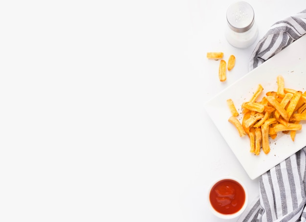 Photo top view of french fries on plate with ketchup