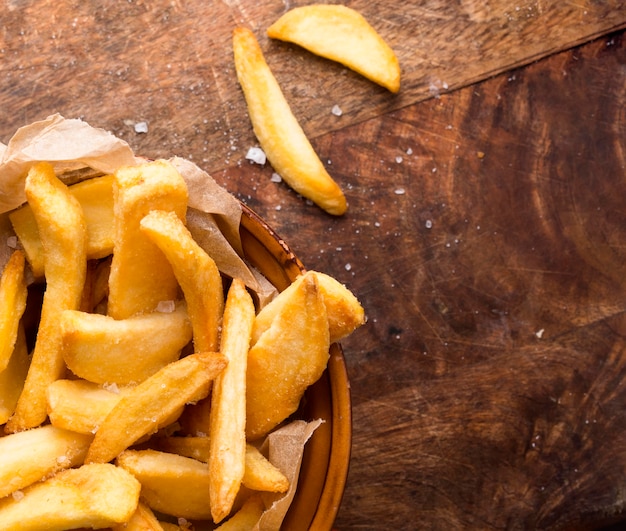 Top view of french fries with salt