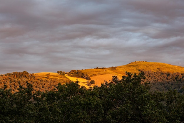 Top view of the french hills on the cloudy sky at sunset