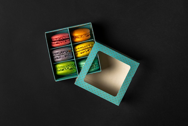 a top view of the french sweet desert macaroons in the cardboard box