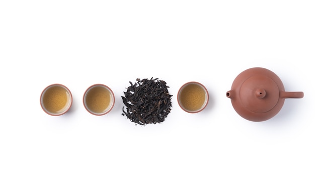 Top view of fresh black tea with kettle teapot and leaves in Taiwan, Asian culture design concept layout.