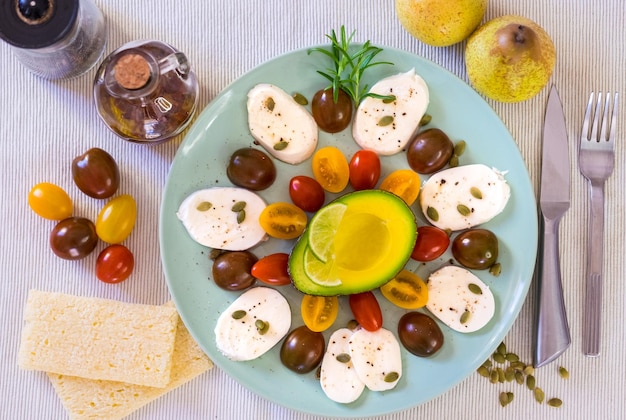 Top view of a fresh caprese salad with cheese mozzarella and cherry tomatoes