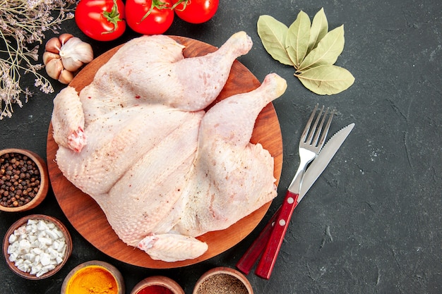 top view fresh chicken with tomatoes and seasonings