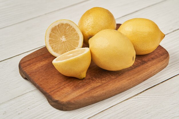 Top view fresh cut lemons on table