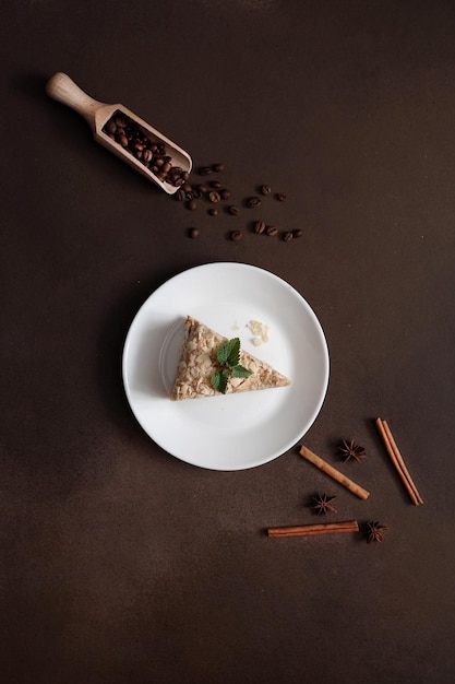 Top view of Fresh delicious Cake Napoleon with cream on a Brown Background