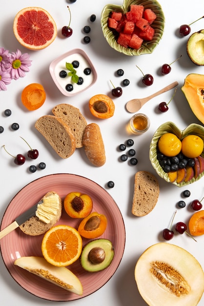 Top view fresh fruits on white background