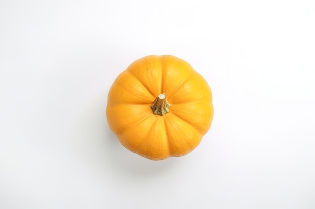 Top view of fresh orange pumpkin isolated on white background
