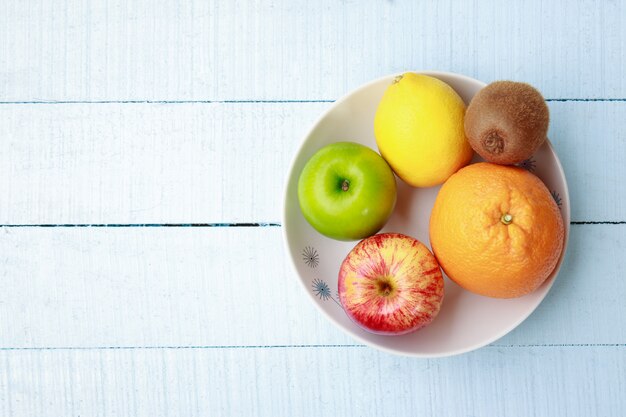 top view of fresh organic fruit on dish 