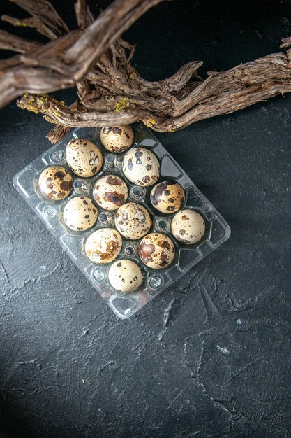 top view fresh quail eggs on dark gray background pie morning bread milk bird breakfast tea