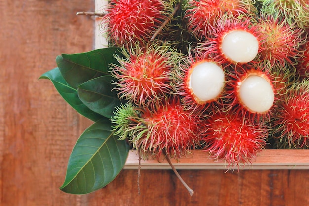 Top view of fresh rambutan in the wooden box