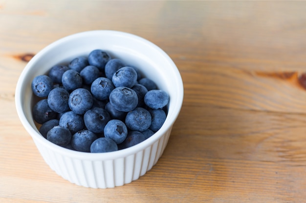 Top view of fresh ripe blueberries in bowl