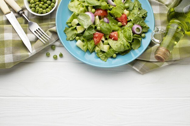 Top view fresh salad frame with copy-space