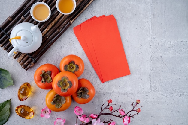 Top view of fresh sweet persimmons kaki with leaves