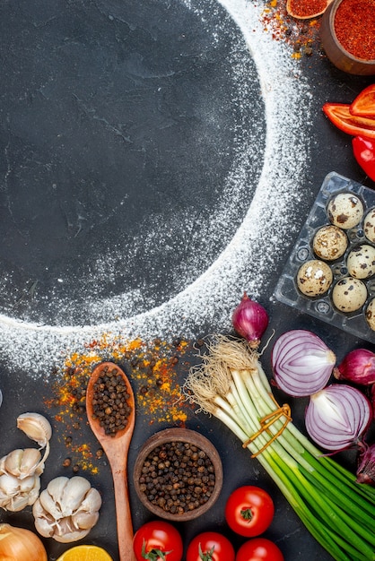 Top view of fresh various foods set with flour around