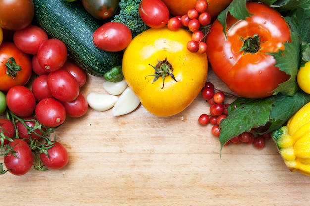 Top view of fresh vegetables on wood background. Copy space