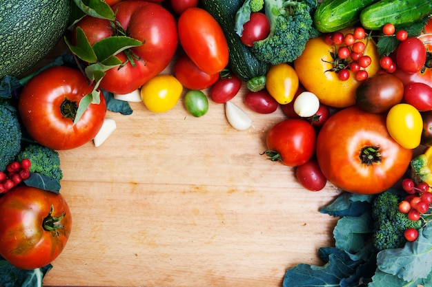 Top view of fresh vegetables on wood background with .