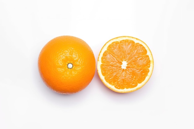 Top view of fresh whole and sliced oranges isolated on white background