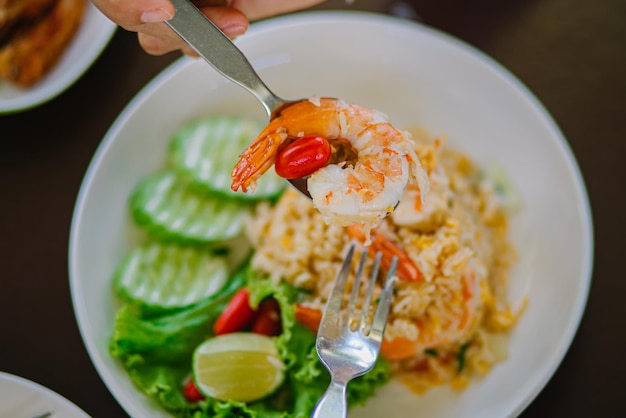 Top view of fried rice with shrimp , focus selective shrimp .