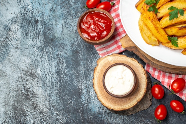 Top view fried tasty potatoes with tomatoes on a light background dinner color photo food dish meat meal salad