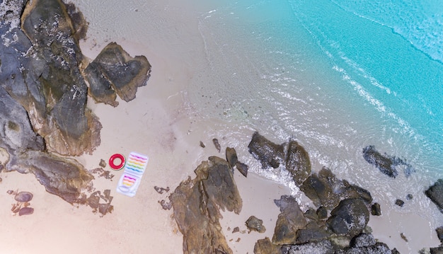 Top view from sky of sea wave and sand beach landscape.