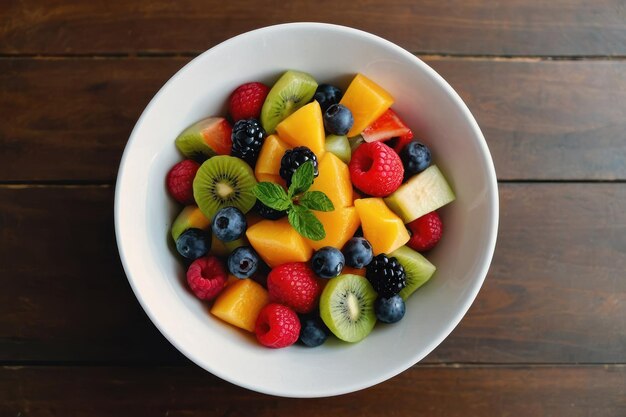 top view fruit salad on a white bowl on brown table