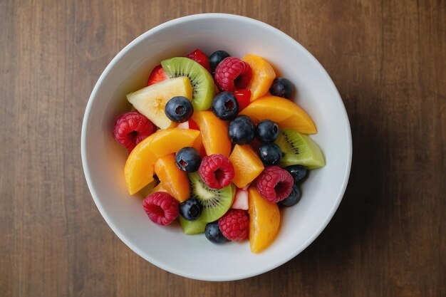 top view fruit salad on a white bowl on brown table