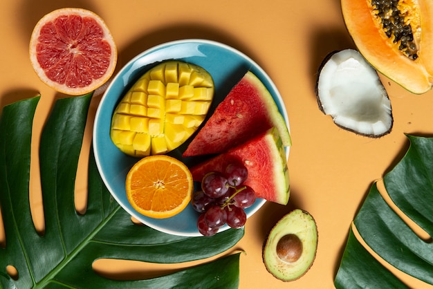 Top view fruits on blue plate