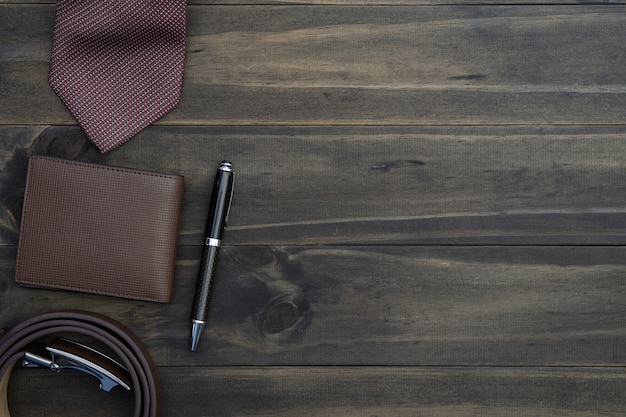 Top view of gentlemen accessories on wood background. 