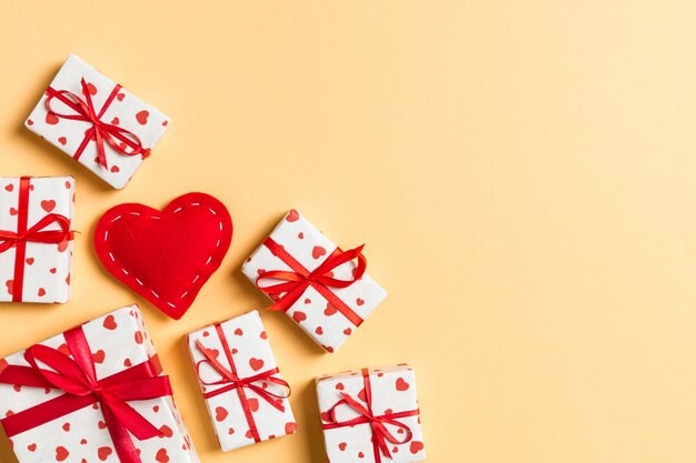 Top view of gift boxes and red textile hearts. St Valentine's day concept with copyspace