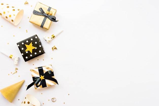 Top view of gift boxes in various black, white and golden 