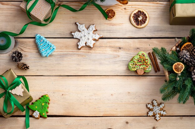 top view of gingerbread cookies on a wooden table with ornaments