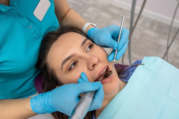 Top view of a girl patient who came to check her teeth at the dentist