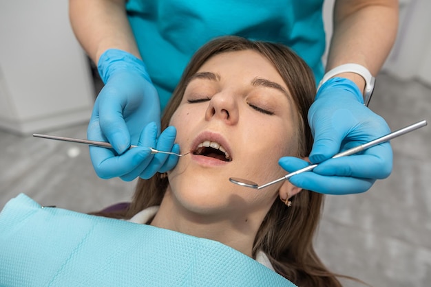 Top view of a girl patient who came to check her teeth at the dentist