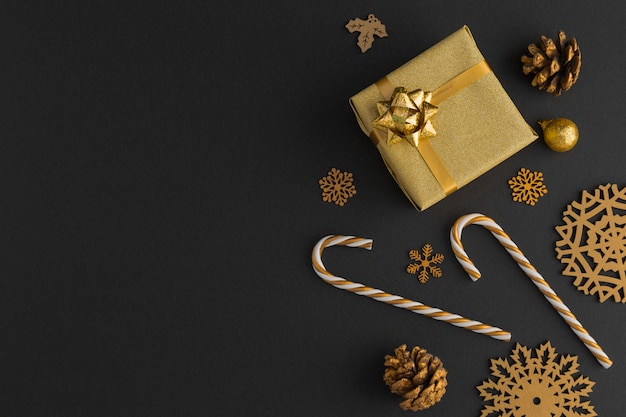 Top view of golden christmas decorations and gift